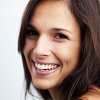 a happy brown-haired woman